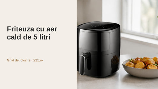 Friteuză cu aer cald neagră pe blatul bucătăriei, lângă un bol cu cartofi și legume